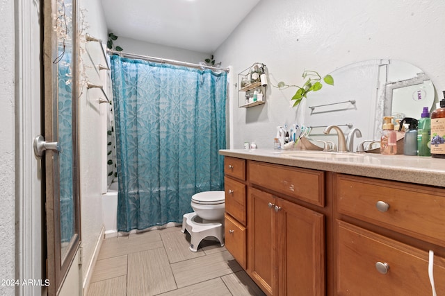 full bathroom featuring vanity, toilet, shower / bathtub combination with curtain, and tile patterned floors