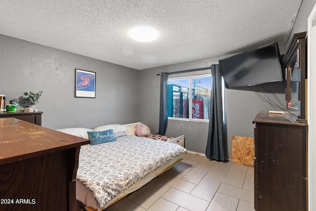 bedroom with a textured ceiling