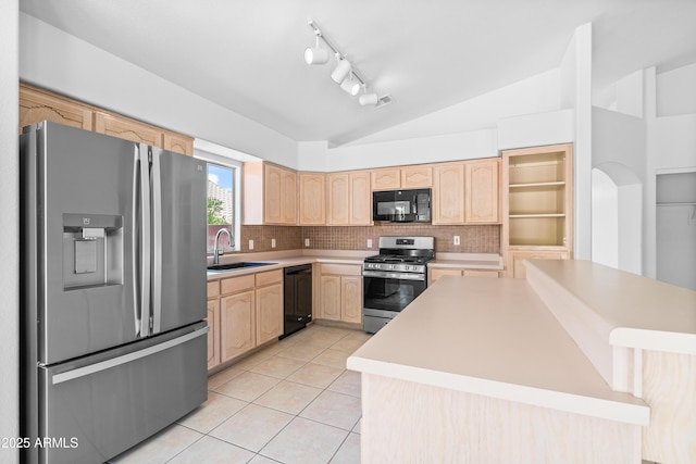 kitchen with a sink, light brown cabinetry, black appliances, and vaulted ceiling