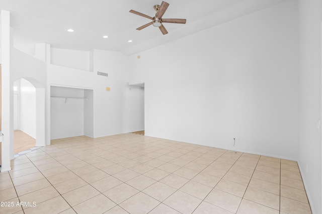 spare room with arched walkways, high vaulted ceiling, a ceiling fan, recessed lighting, and visible vents