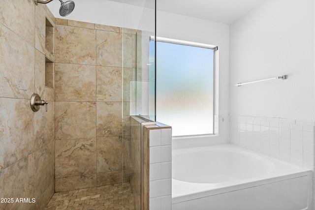 full bathroom with a bath and a stall shower