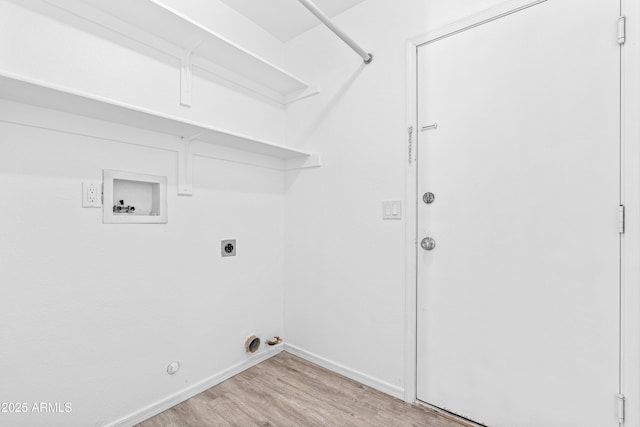 washroom featuring laundry area, light wood finished floors, hookup for a washing machine, hookup for a gas dryer, and baseboards