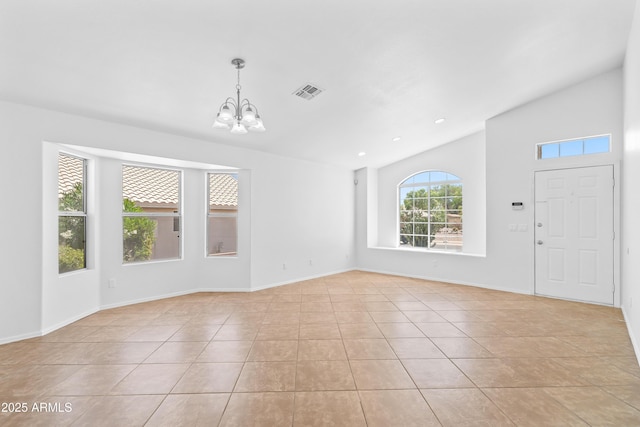 interior space with a chandelier, baseboards, light tile patterned floors, vaulted ceiling, and visible vents