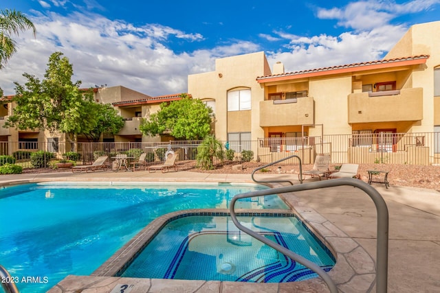 7008 E Gold Dust Ave Unit 236, Scottsdale, AZ 85253 - community pool featuring a community hot tub and a patio