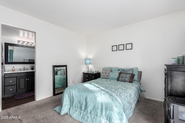 bedroom featuring carpet floors and connected bathroom