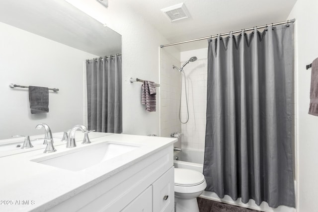 full bathroom with shower / bath combo with shower curtain, vanity, and toilet