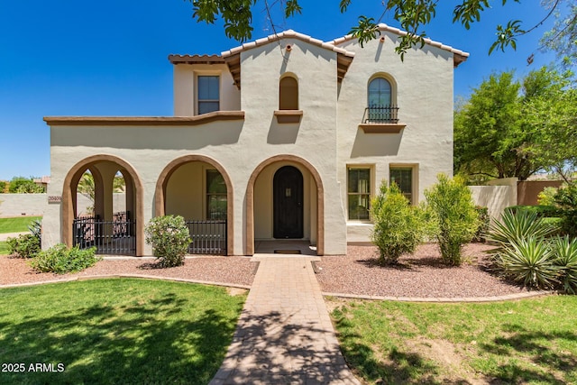20409 W Thayer St, Buckeye, AZ 85396 - mediterranean / spanish-style house with stucco siding, a tiled roof, and a porch