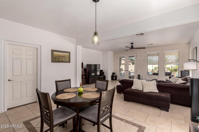 20409 W Thayer St, Buckeye, AZ 85396 - dining room featuring light tile patterned floors, french doors, and ceiling fan