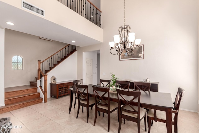 20409 W Thayer St, Buckeye, AZ 85396 - dining room featuring stairway, a chandelier, a high ceiling, and recessed lighting