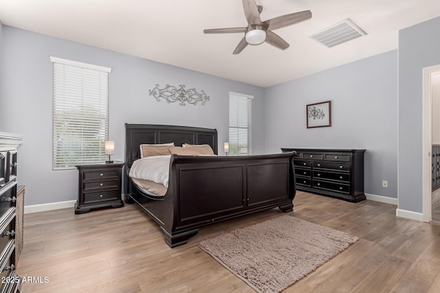20409 W Thayer St, Buckeye, AZ 85396 - bedroom featuring light wood finished floors and a ceiling fan