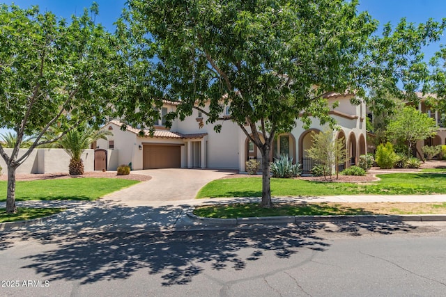 20409 W Thayer St, Buckeye, AZ 85396 - view of front of house featuring stucco siding, driveway, an attached garage, and a tile roof