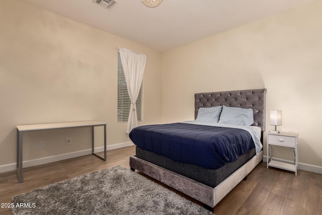 20409 W Thayer St, Buckeye, AZ 85396 - bedroom featuring wood finished floors and baseboards