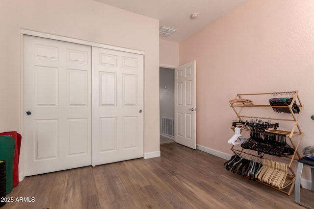 20409 W Thayer St, Buckeye, AZ 85396 - bedroom featuring wood finished floors and a closet