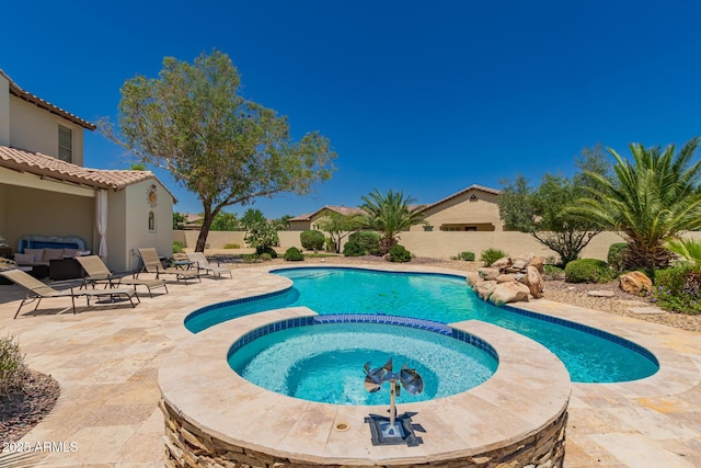 20409 W Thayer St, Buckeye, AZ 85396 - view of pool with a patio, a fenced backyard, a pool with connected hot tub, and an outdoor hangout area