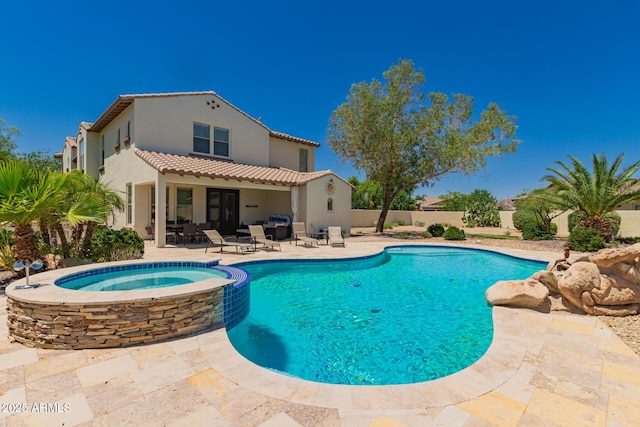 20409 W Thayer St, Buckeye, AZ 85396 - view of swimming pool with a patio and a pool with connected hot tub