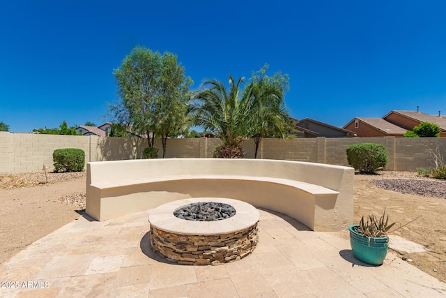20409 W Thayer St, Buckeye, AZ 85396 - fenced backyard with a fire pit and a patio