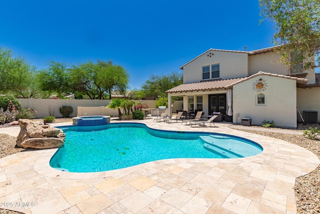 20409 W Thayer St, Buckeye, AZ 85396 - view of swimming pool with a patio area, a fenced backyard, and a pool with connected hot tub