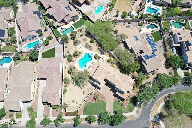 20409 W Thayer St, Buckeye, AZ 85396 - aerial overview of property's location with a pool and nearby suburban area