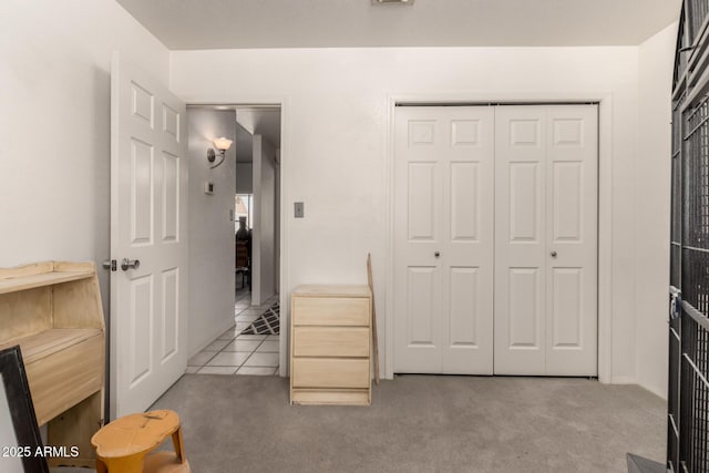 carpeted bedroom featuring a closet