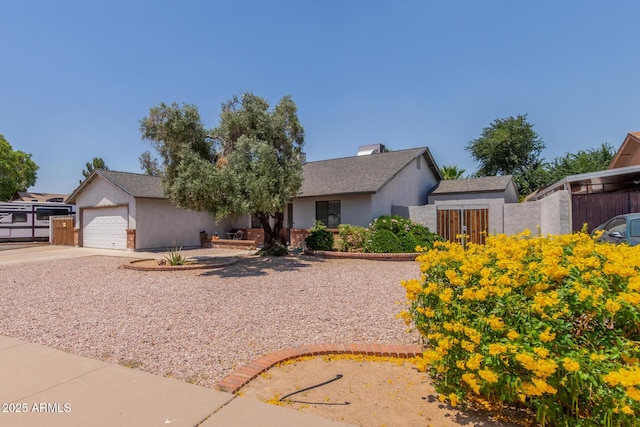view of front of house with concrete driveway, a garage, and stucco siding
