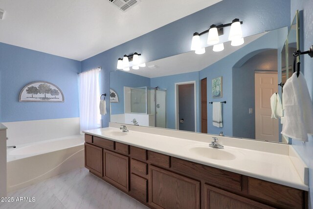 6993 S Sharon Ct, Chandler, AZ 85249 - bathroom with a shower stall, a garden tub, visible vents, and a sink
