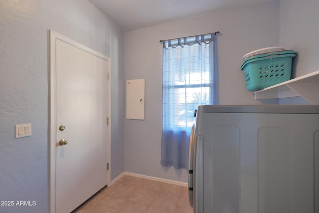 6993 S Sharon Ct, Chandler, AZ 85249 - clothes washing area with laundry area, light tile patterned flooring, washer / dryer, a textured wall, and baseboards