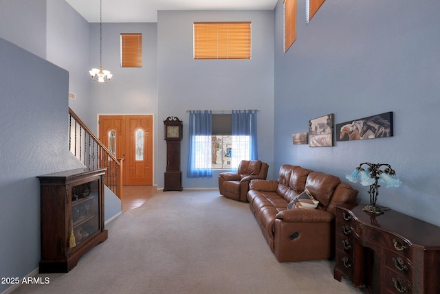 6993 S Sharon Ct, Chandler, AZ 85249 - living area featuring carpet floors, a chandelier, a high ceiling, stairs, and baseboards