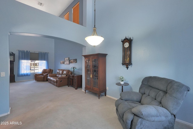6993 S Sharon Ct, Chandler, AZ 85249 - interior space featuring carpet floors, baseboards, arched walkways, and a towering ceiling
