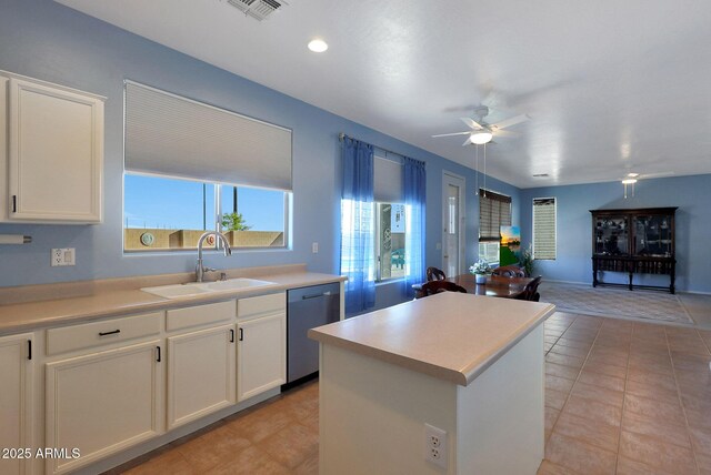 6993 S Sharon Ct, Chandler, AZ 85249 - kitchen with ceiling fan, visible vents, a kitchen island, dishwasher, and a sink