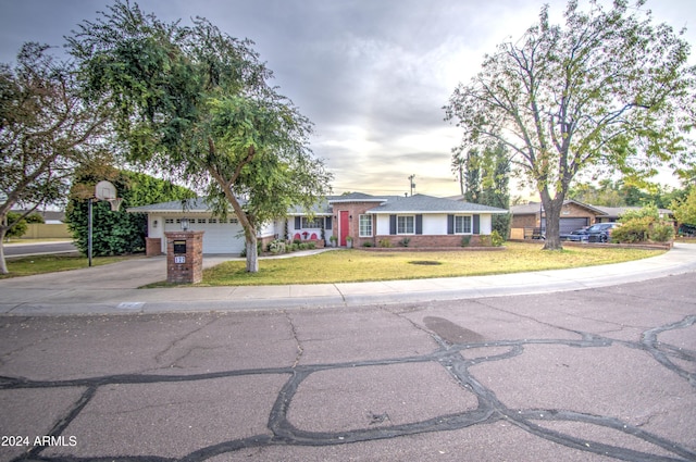 ranch-style home with a front yard