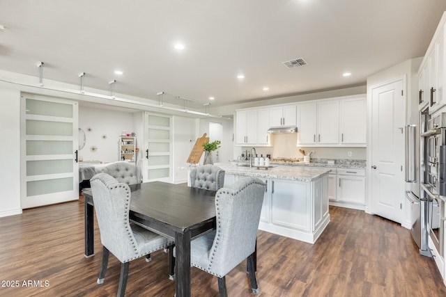 dining space with recessed lighting, dark wood-style flooring, and visible vents