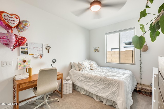 bedroom featuring a ceiling fan and light carpet