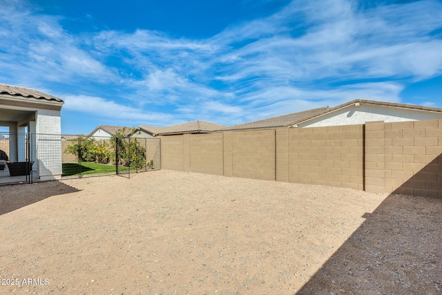 view of yard featuring a fenced backyard and a patio