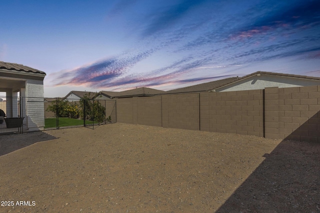 view of yard with a fenced backyard