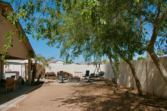 view of yard featuring a patio and a fenced backyard