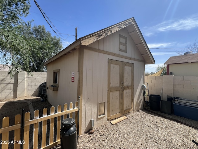 view of shed featuring a fenced backyard