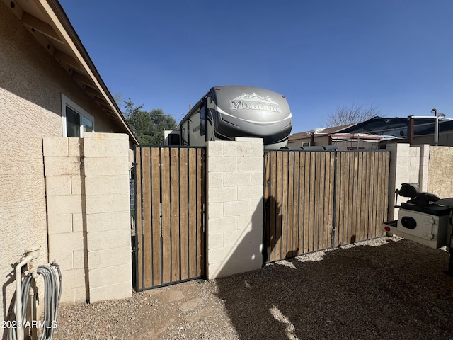 view of gate featuring fence