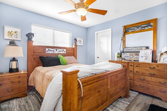 bedroom featuring dark wood-type flooring and ceiling fan