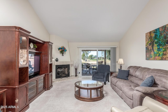 carpeted living room with lofted ceiling and a fireplace