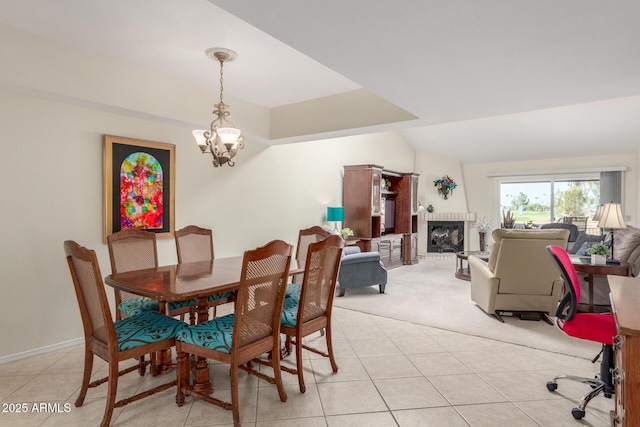 tiled dining space featuring a chandelier