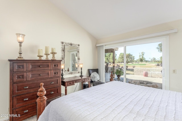 bedroom with access to outside and lofted ceiling