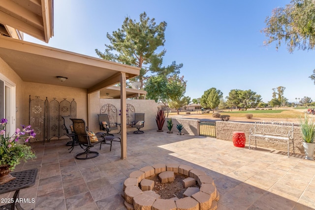 view of patio featuring a fire pit