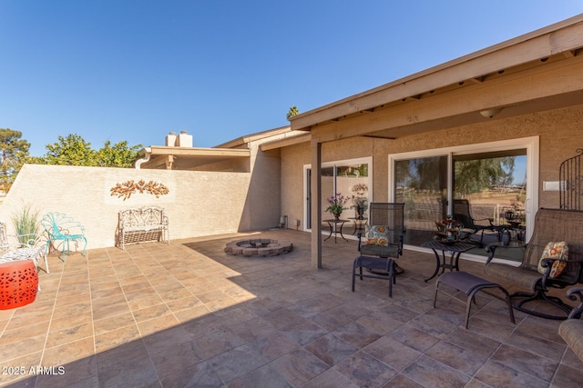 view of patio / terrace with an outdoor fire pit