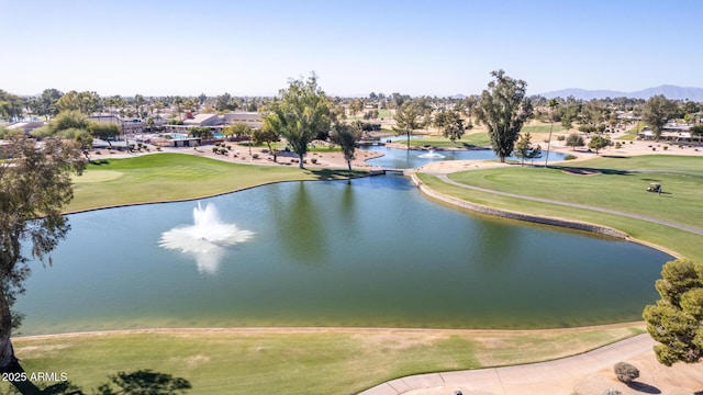 birds eye view of property with a water and mountain view