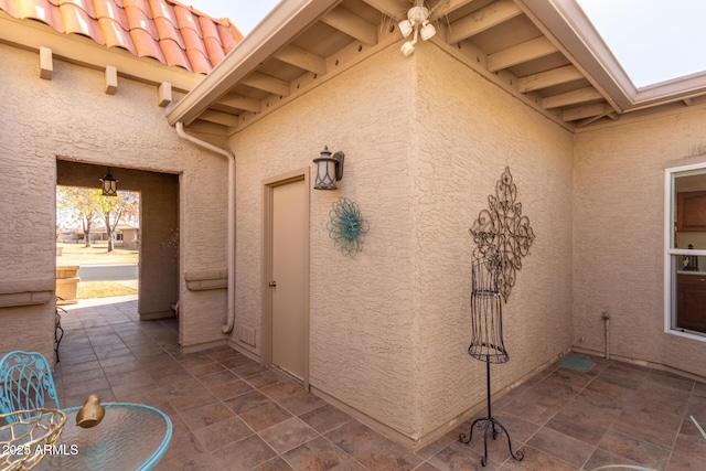 property entrance featuring a patio area