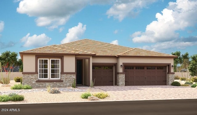 prairie-style house featuring a garage