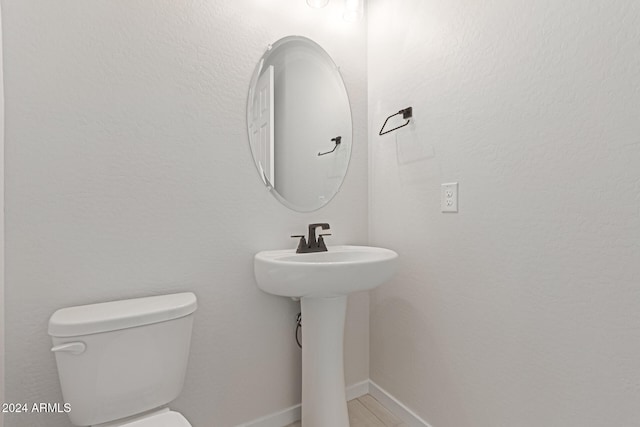 bathroom featuring toilet