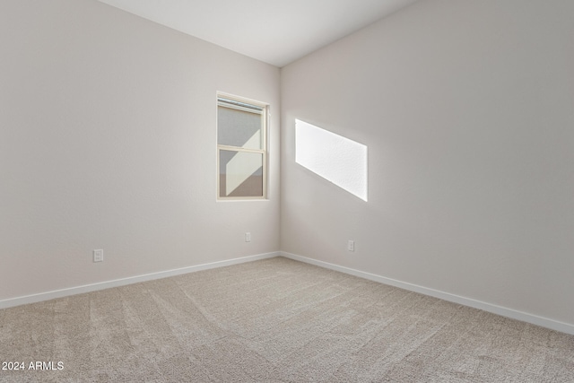 unfurnished room featuring carpet floors