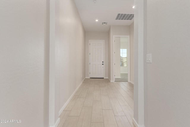 hallway with light wood-type flooring