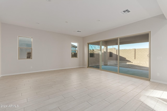 spare room featuring light wood-type flooring